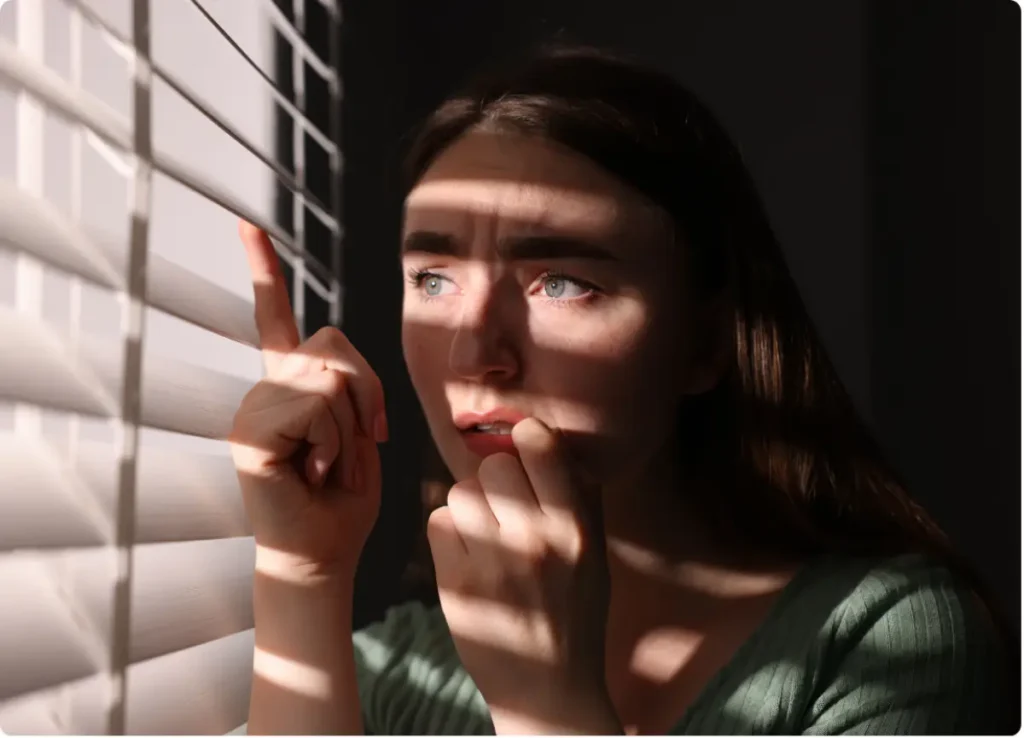 Woman experiencing schizophrenia symptoms seeking mental health treatment and support.